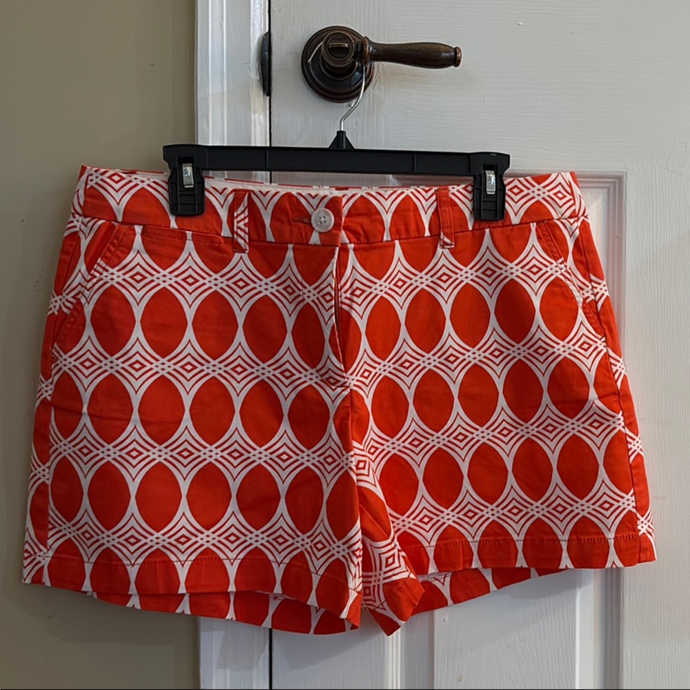 Orange and white geometric print Crown & ivy shorts. 98% cotton 2% spandex